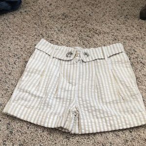 Khaki and White striped shorts with pockets.